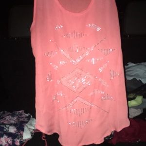 This is a pink tank top with jewels
